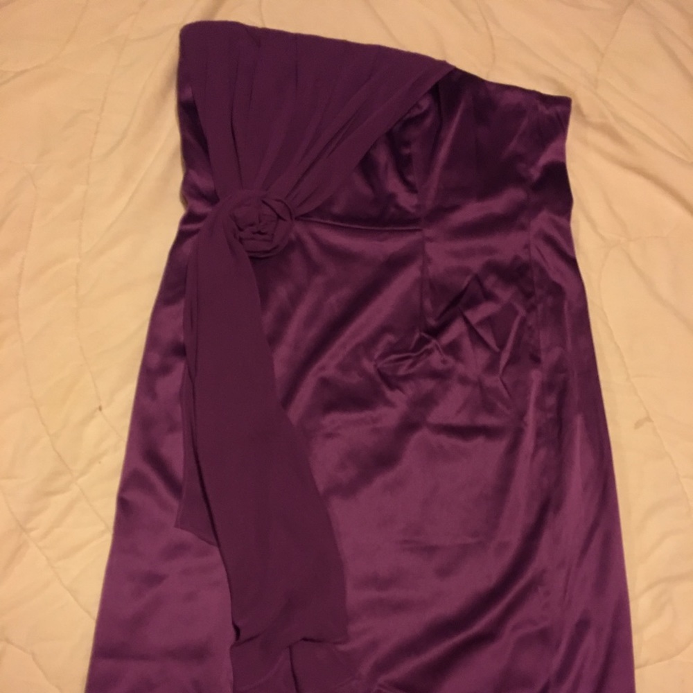 Purple strapless dress.